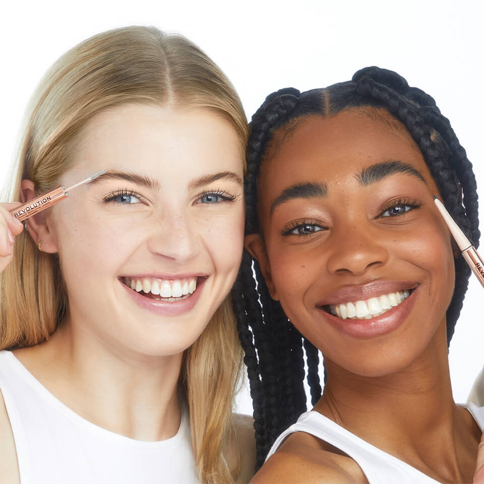 An image of 2 models smiling and holding Makeup Revolution Fluffy Brow Filter Duo 